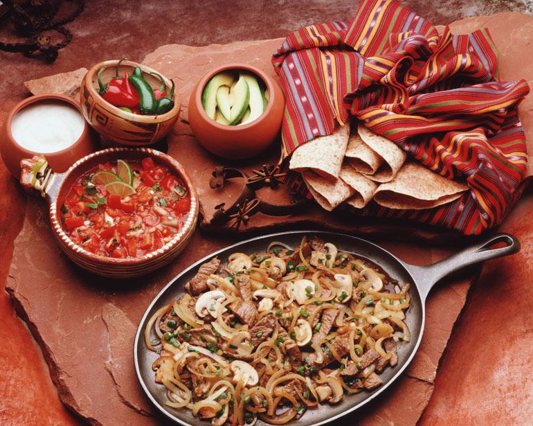 Mexican cuisine, meat, mushrooms and onions